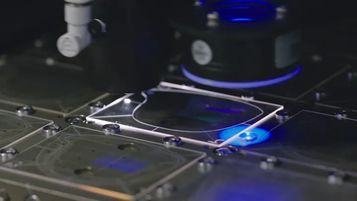 A waveguide plate under a processing head on the production line